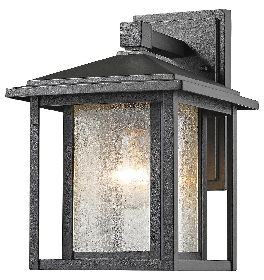 Black  Single Light 9in Wide Outdoor Wall Sconce with Seedy Glass Shade by Z-Lite