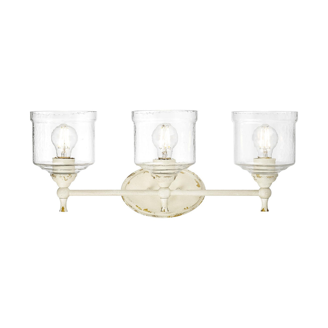 3 Light Bath Vanity In Antique Ivory With Hammered Water Glass Shade by Golden