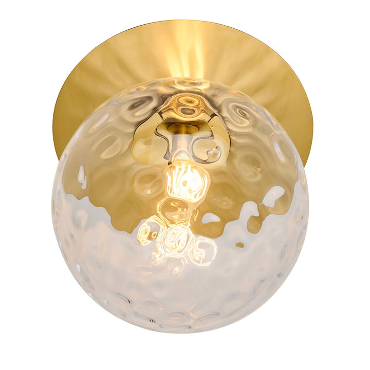 1 Light Aged Brass Incandescent Wall Sconce With Hammered Glass Globe by Dainolite