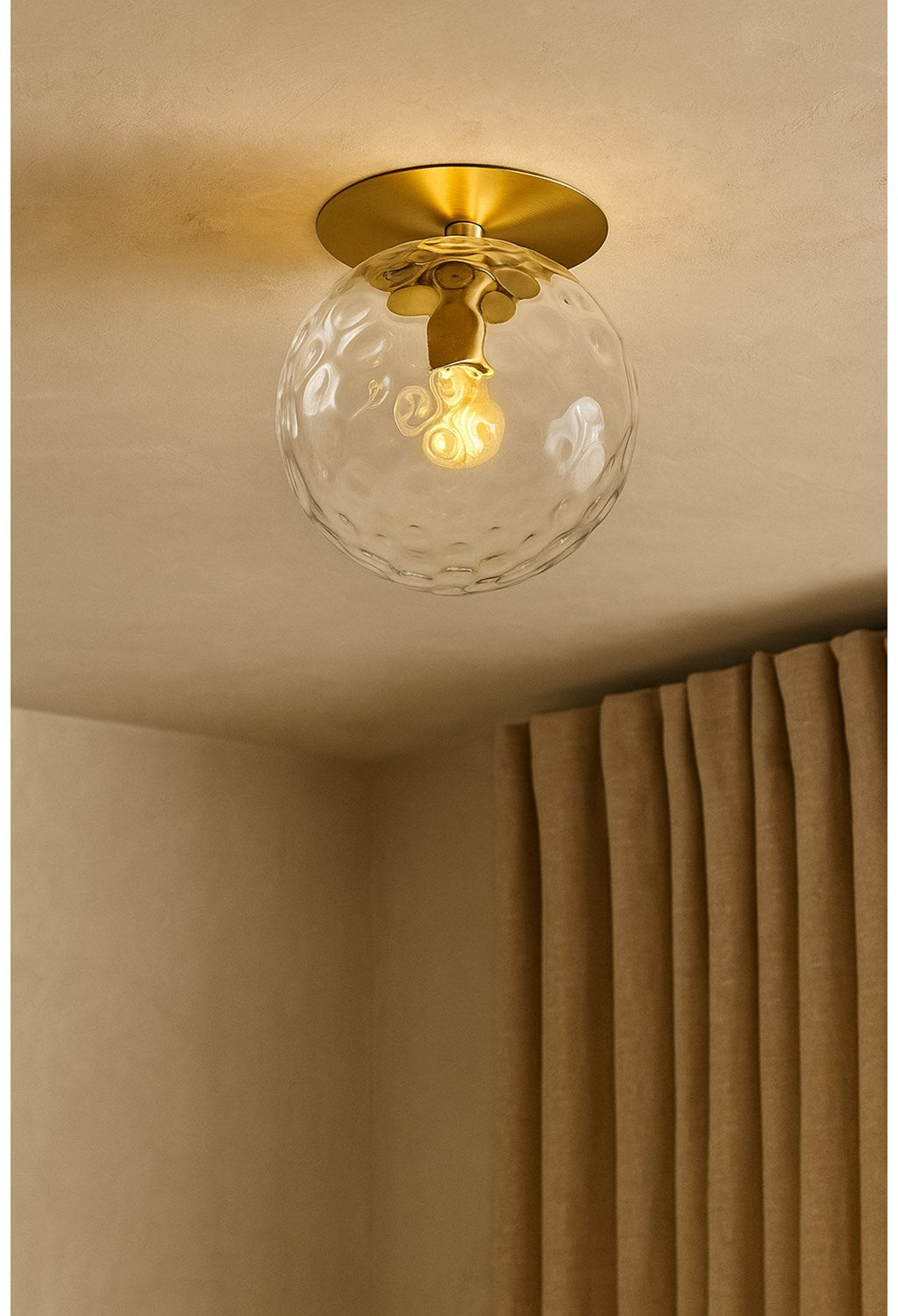 1 Light Aged Brass Incandescent Wall Sconce With Hammered Glass Globe